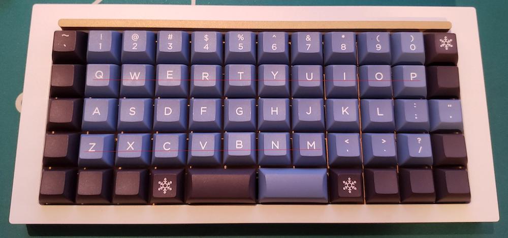 keycaps with non-uniform legending printing